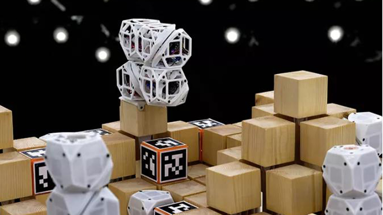 CuGo robotic units rearranging blocks